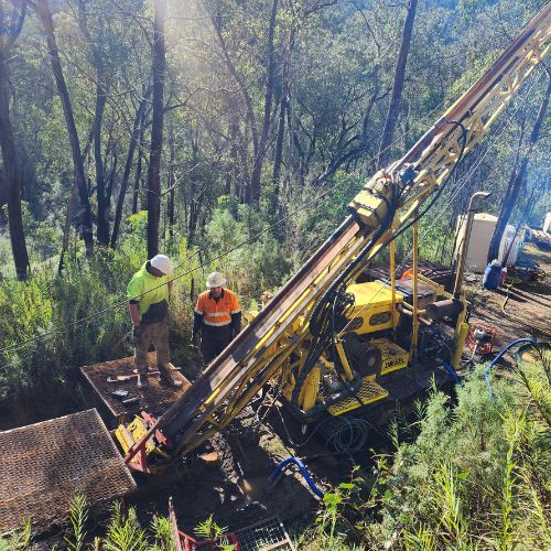 Prestige Drilling Services track-mounted rig accessing a remote, high-altitude site in the Victorian Alps.